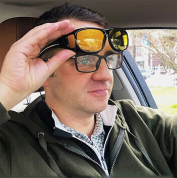 Andrew M. demonstrating headlight glare reduction inside car cabin